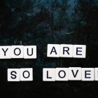 You are so loved spelt out using Scrabble letters flatlay