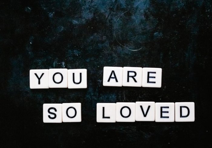 You are so loved spelt out using Scrabble letters flatlay